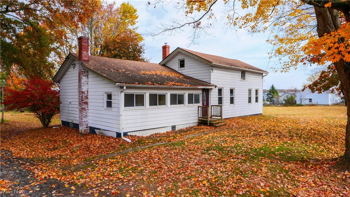 14080 Nash Road Burton, OH 44021 - Photo 1 of 49 Rear view of property with a sunroom