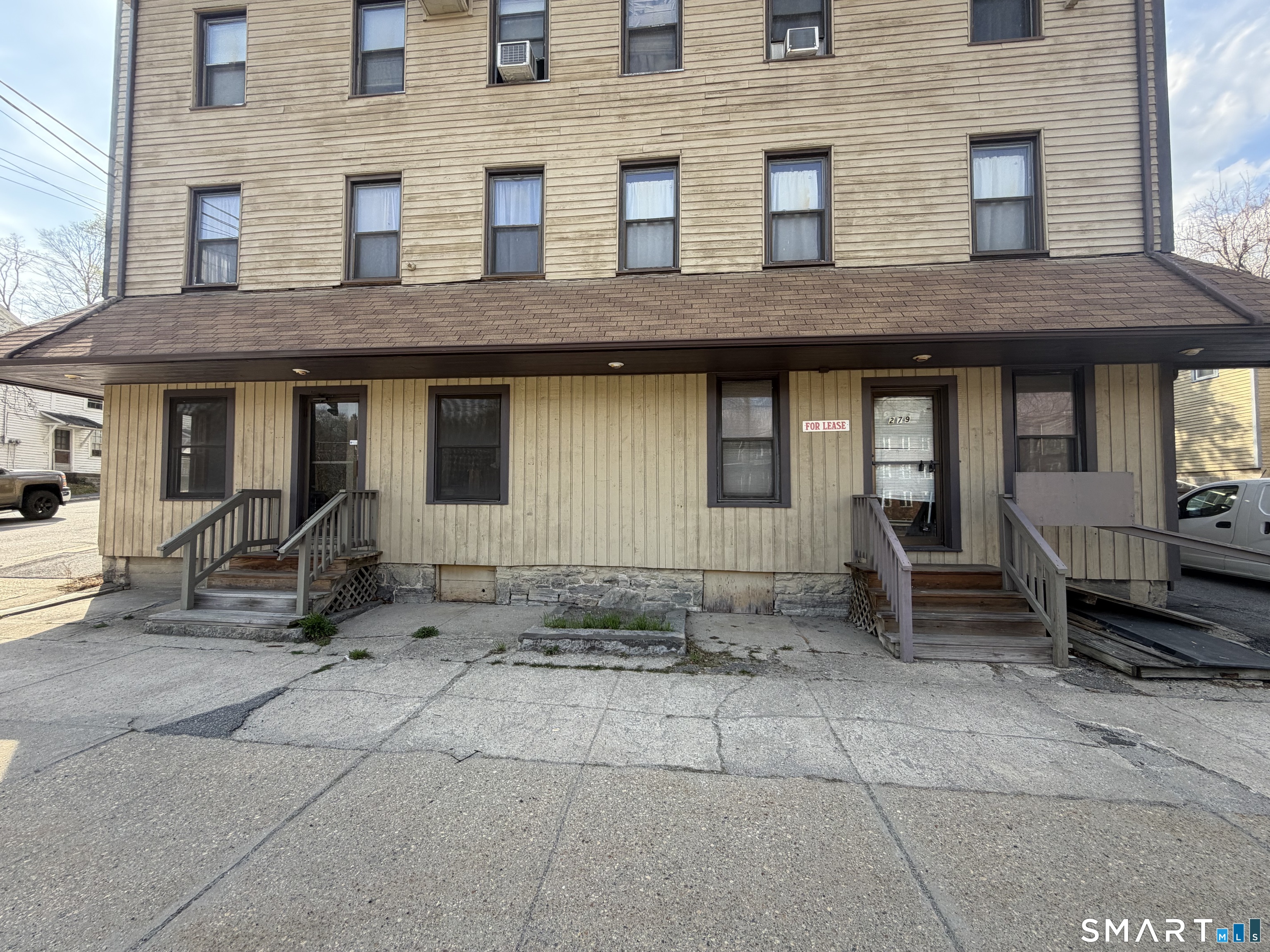 277 North Main Street, Unit 3 Winchester, CT 06098 - Photo 1 of 14 a view of a house with backyard and chairs