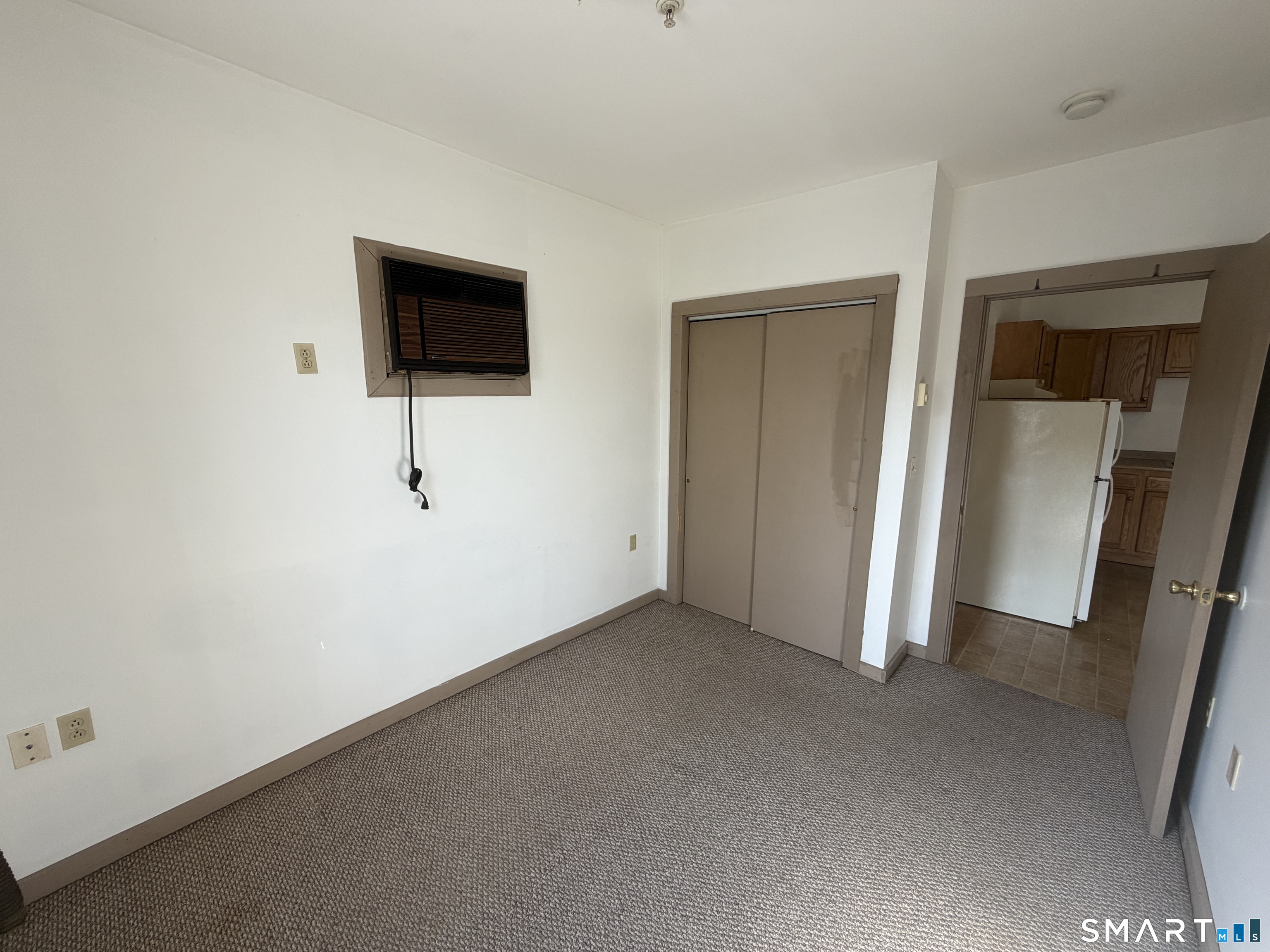 277 North Main Street, Unit 3 Winchester, CT 06098 - Photo 12 of 14 a view of empty room with wooden floor