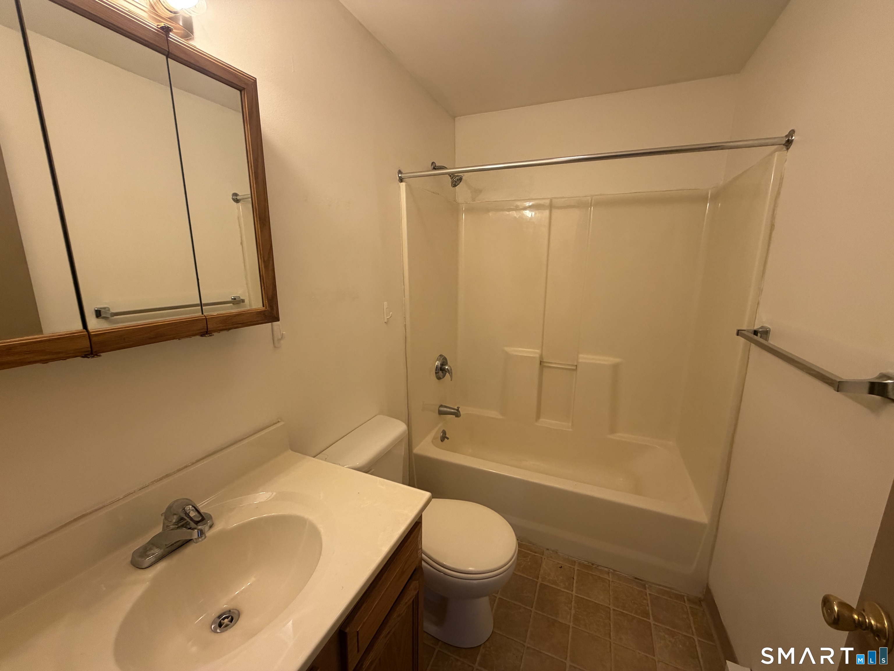277 North Main Street, Unit 3 Winchester, CT 06098 - Photo 13 of 14 a bathroom with a sink and a mirror