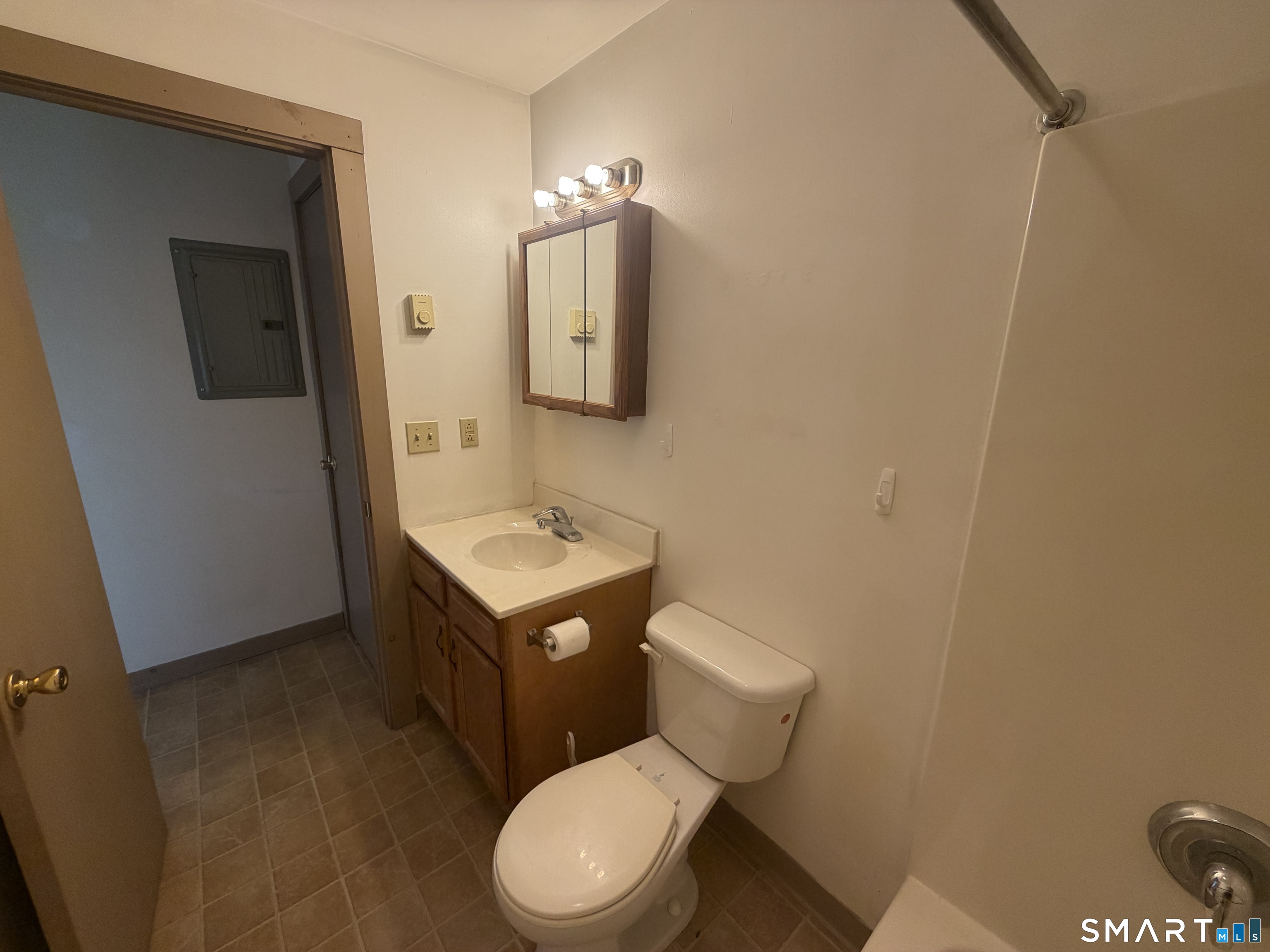 277 North Main Street, Unit 3 Winchester, CT 06098 - Photo 14 of 14 a white toilet sitting next to a bathroom sink