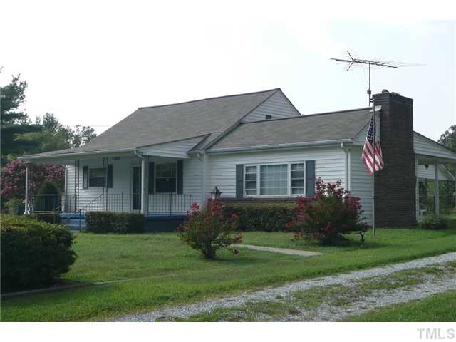 289 Chambers Loop Road Timberlake, NC 27583 - Photo 4 of 20 a front view of a house with garden