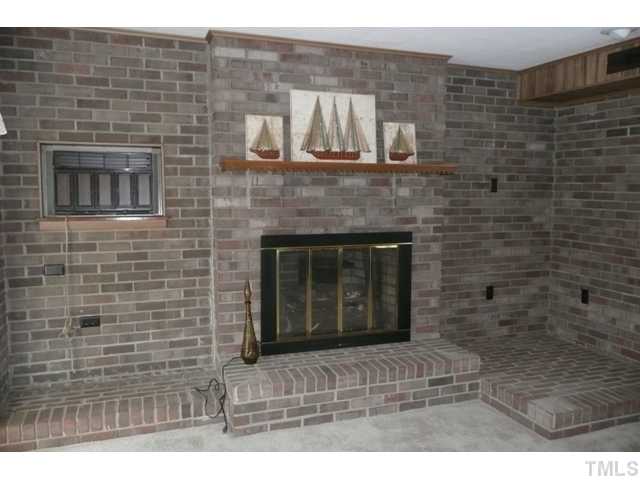 289 Chambers Loop Road Timberlake, NC 27583 - Photo 10 of 20 a stone house with fireplace