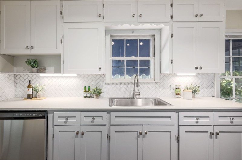 1206 Madison Avenue Austin, TX 78757 - Photo 1 of 1 a kitchen with a sink and cabinets