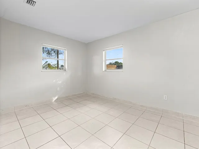 an empty room with windows