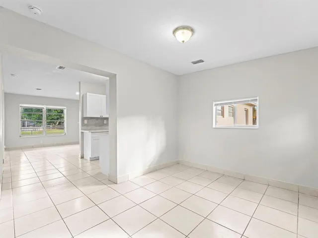 a view of kitchen with furniture and window