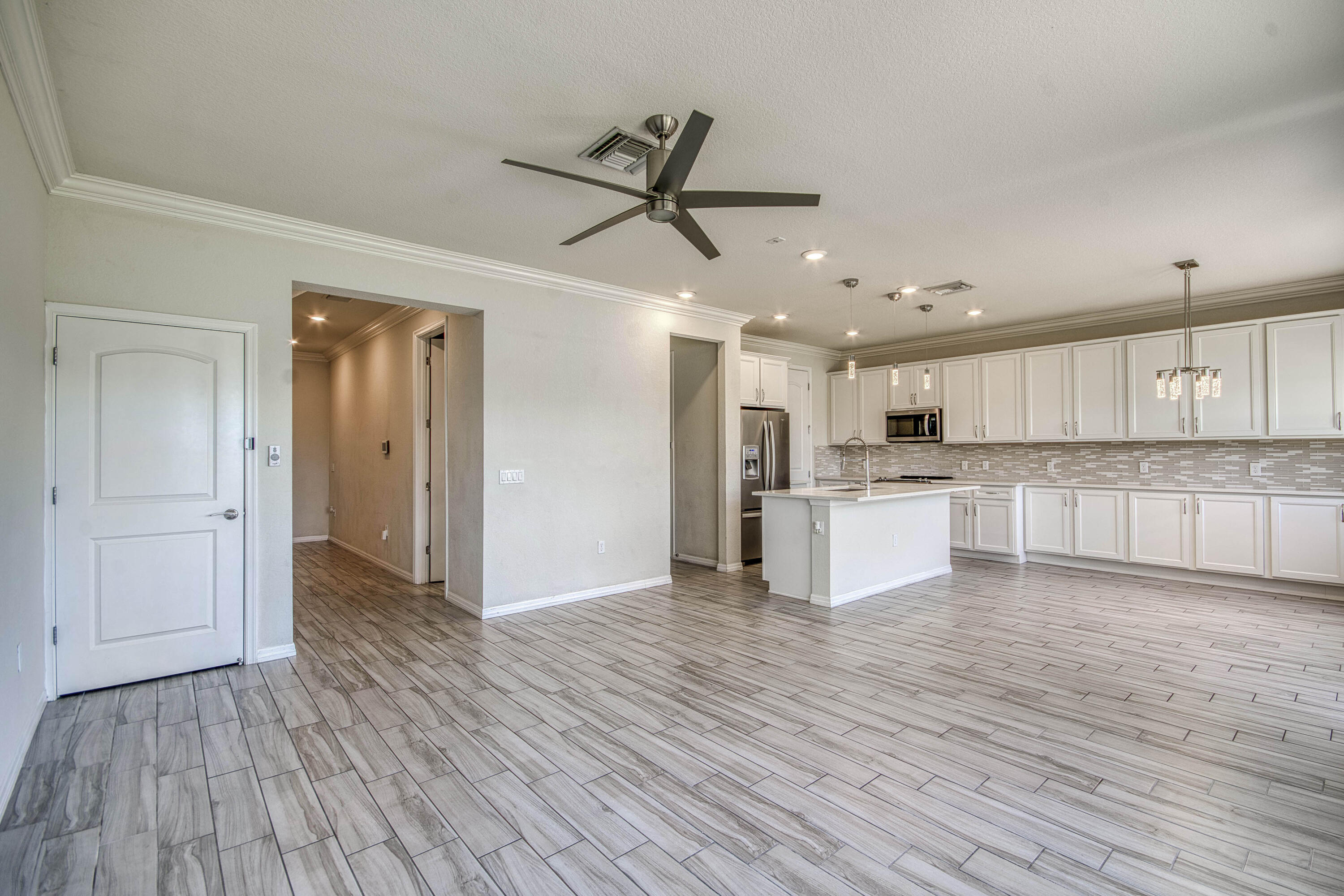 8301 Rearing Lane Lake Worth, FL 33467 - Photo 7 of 33 a view of a kitchen with wooden floor and a window
