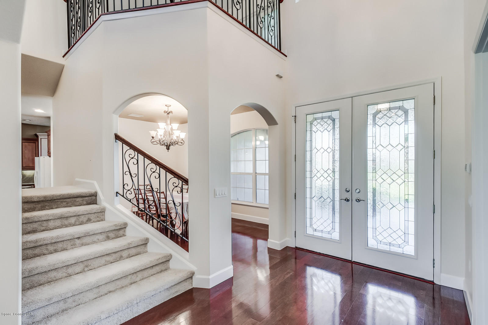 42 Country Club Road Cocoa Beach, FL 32931 - Photo 3 of 26 a view of entryway and hall with wooden floor
