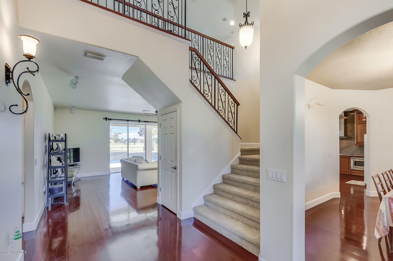 42 Country Club Road Cocoa Beach, FL 32931 - Photo 4 of 26 a view of entryway and hall with wooden floor