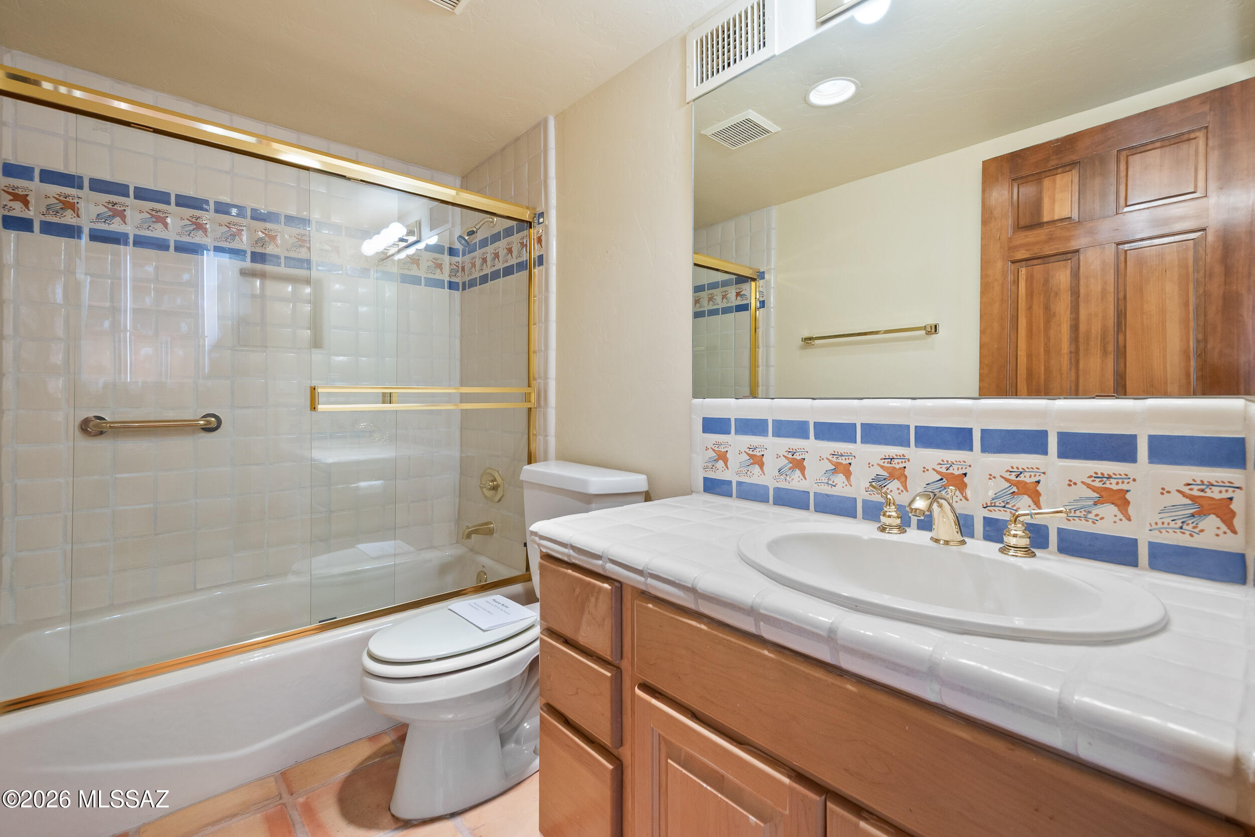 13630 East Sahuaro Sunset Road Tucson, AZ 85749 - Photo 20 of 47 a bathroom with a sink a toilet and shower
