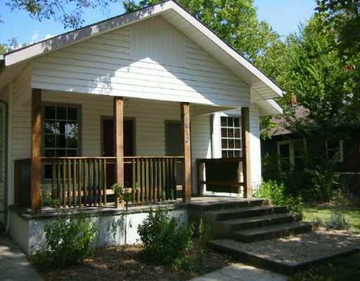1910 Willow Street Austin, TX 78702 - Photo 1 of 1 a front view of a house with a yard
