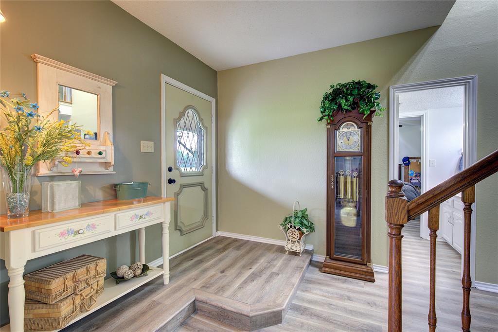 753 County Rd SW 3110 Mount Vernon, TX 75457 - Photo 5 of 40 Walk into a grand entryway with a curved wooden staircase to the second floor. new LVP in most of home