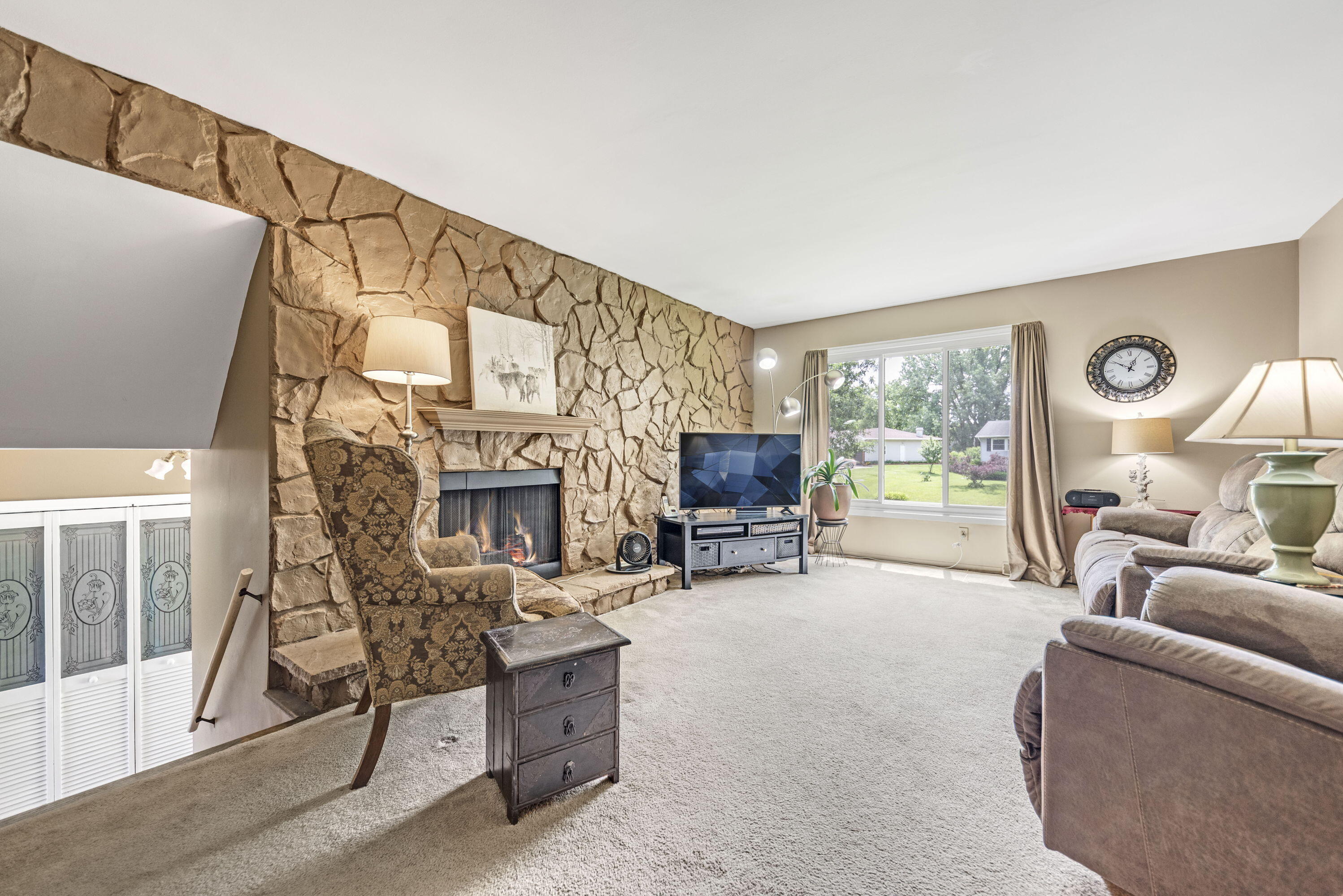 2337 Four Seasons Parkway Crown Point, IN 46307 - Photo 3 of 18 a living room with furniture a fireplace and a flat screen tv