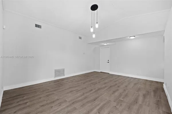 a view of an empty room with a window