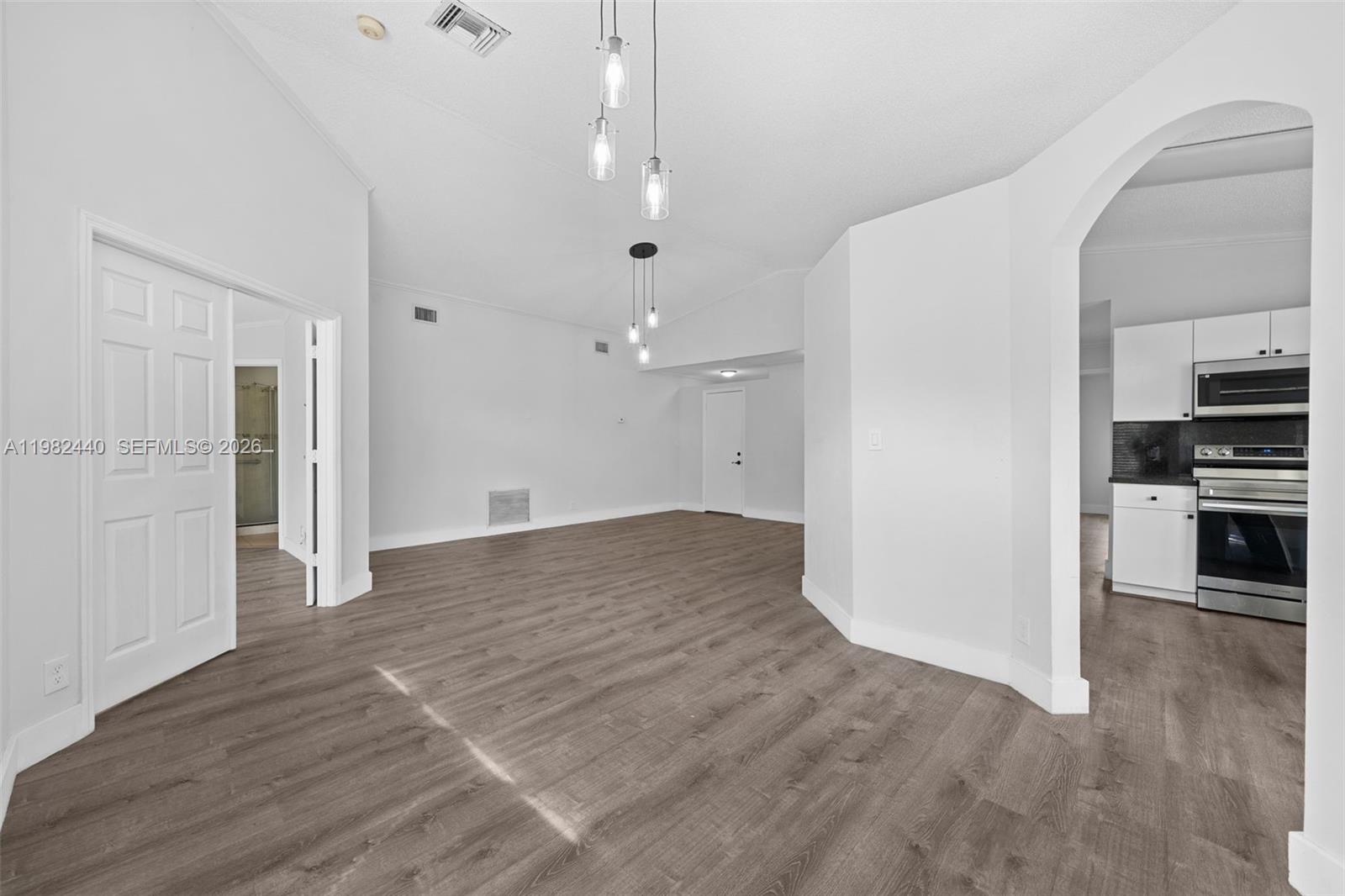 8050 Southwest 157th Place Miami, FL 33193 - Photo 6 of 12 a view of a kitchen with wooden floor
