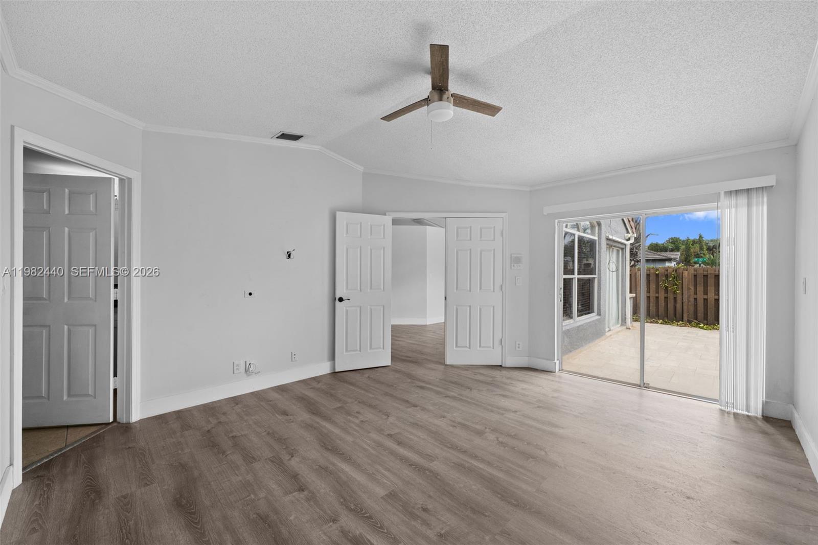 8050 Southwest 157th Place Miami, FL 33193 - Photo 9 of 12 a view of empty room with wooden floor