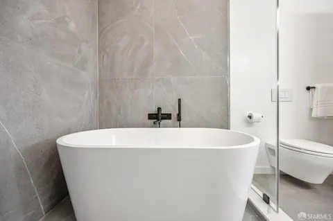 a white bath tub sitting in a bathroom
