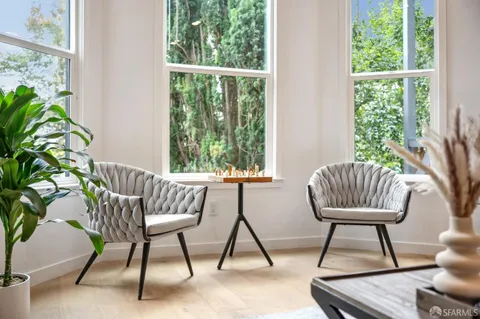 a wooden chairs in a balcony