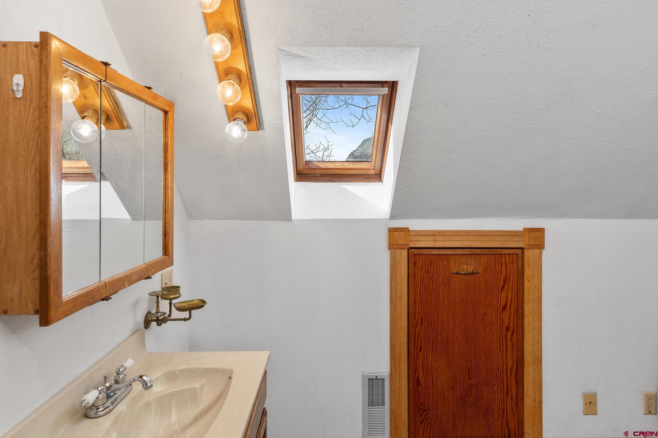35 Porphyry Street Ophir, CO 81426 - Photo 14 of 40 a bathroom with a sink and a mirror