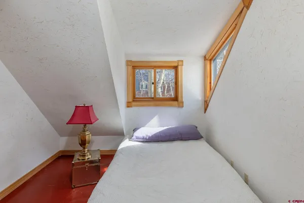 a view of a dry yard with mountains in the background