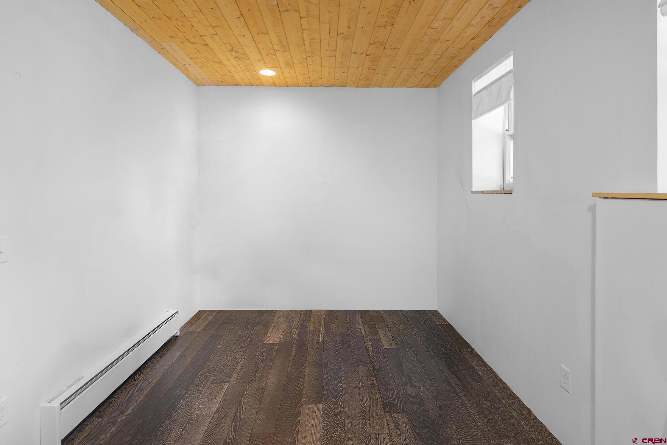 35 Porphyry Street Ophir, CO 81426 - Photo 20 of 40 a view of a small space with wooden floor and a window