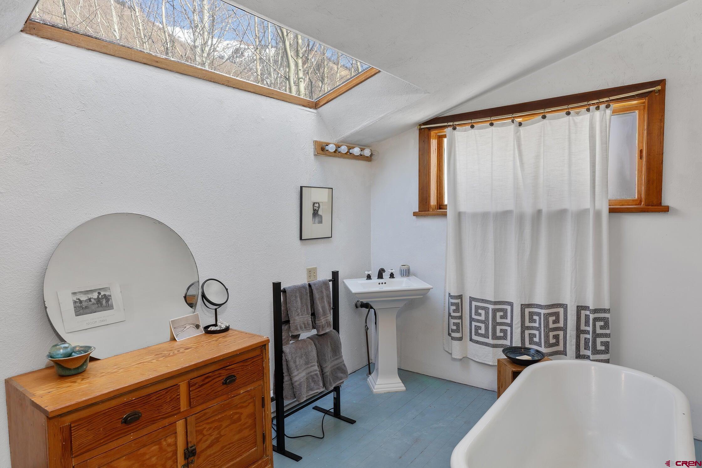 35 Porphyry Street Ophir, CO 81426 - Photo 10 of 40 a room with a baby crib and a dresser