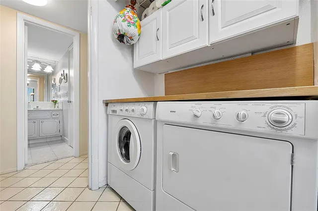 a bathroom with a bathtub sink and mirror