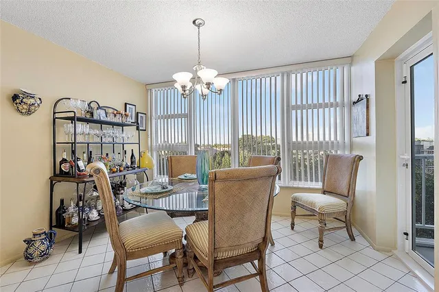 a kitchen with stainless steel appliances a sink dishwasher stove and white cabinets