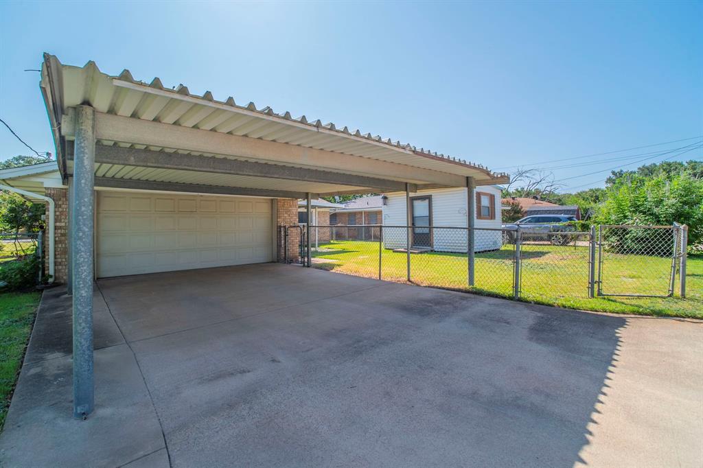 705 South 4th Street Midlothian, TX 76065 - Photo 15 of 15 a view of a swimming pool with an outdoor seating and a yard