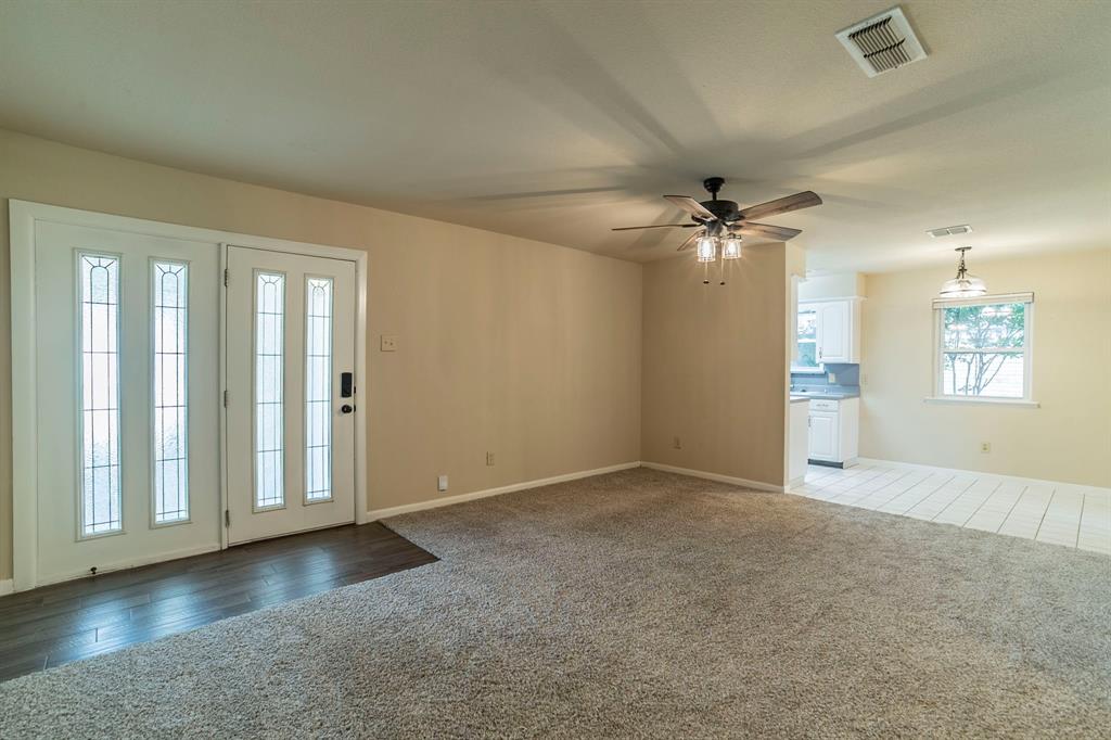 705 South 4th Street Midlothian, TX 76065 - Photo 6 of 15 an empty room with fan and windows