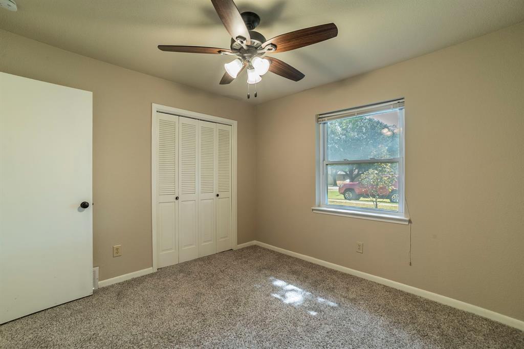 705 South 4th Street Midlothian, TX 76065 - Photo 10 of 15 a view of an empty room with a window
