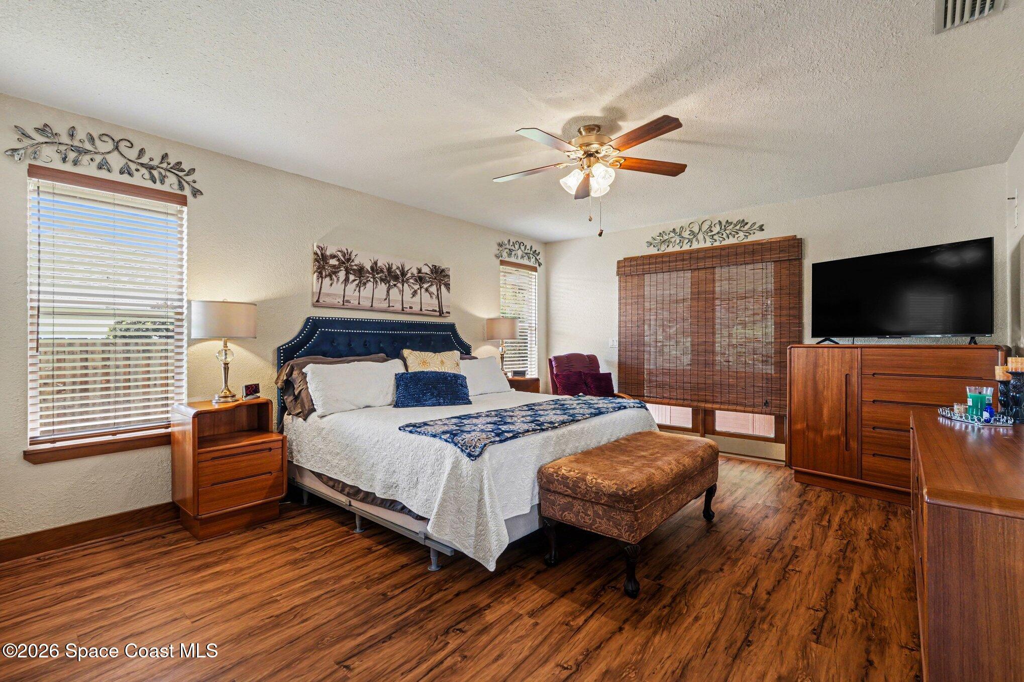 2604 Senator Way Melbourne, FL 32901 - Photo 12 of 27 a bedroom with a bed and a flat screen tv