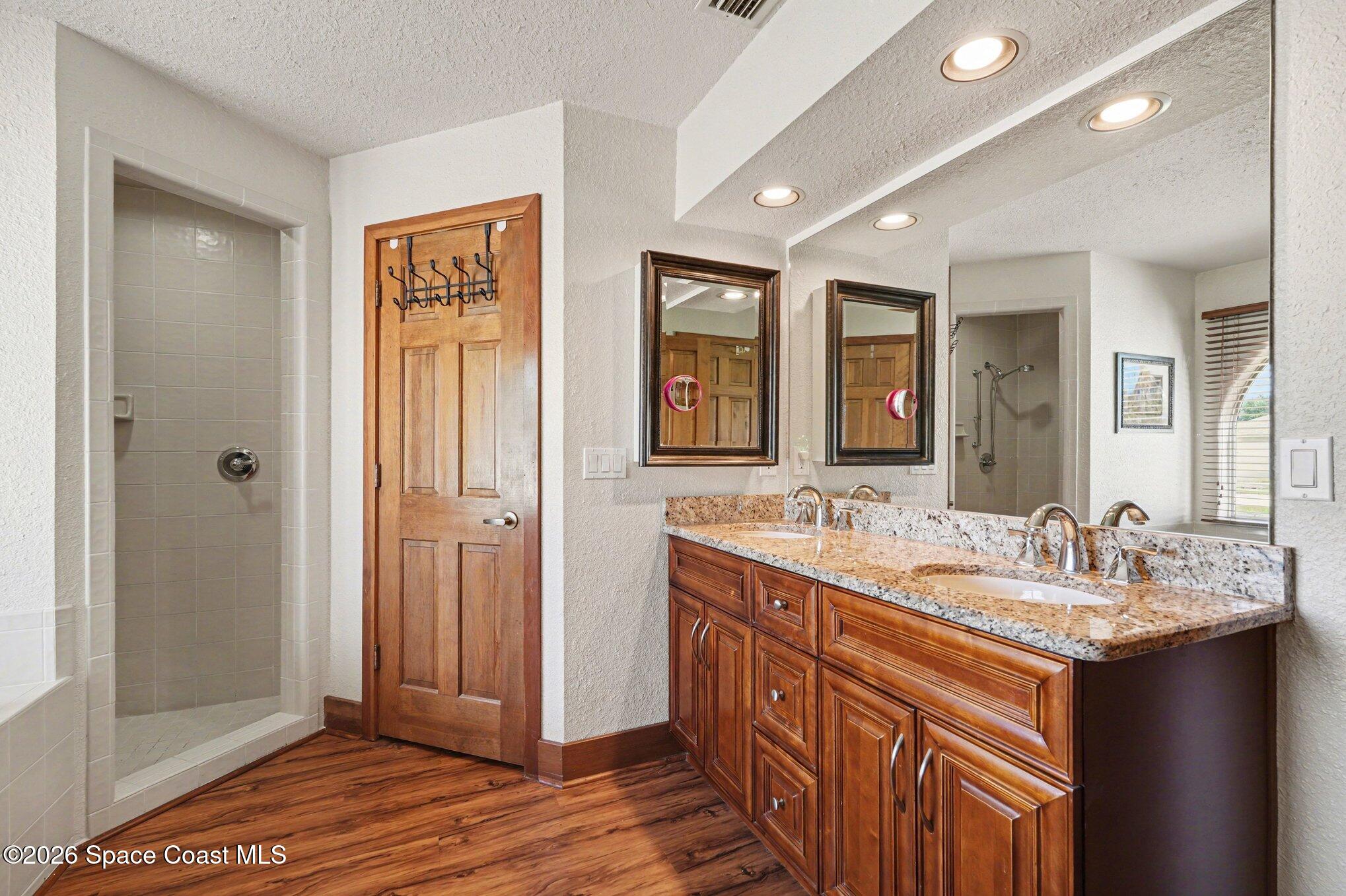 2604 Senator Way Melbourne, FL 32901 - Photo 20 of 27 a bathroom with a double vanity sink and a mirror