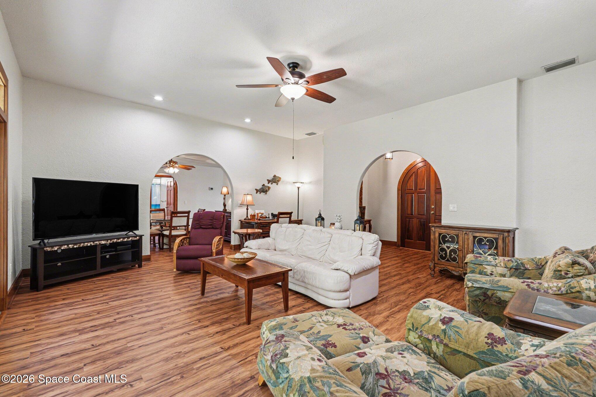 2604 Senator Way Melbourne, FL 32901 - Photo 5 of 27 a living room with furniture and a flat screen tv