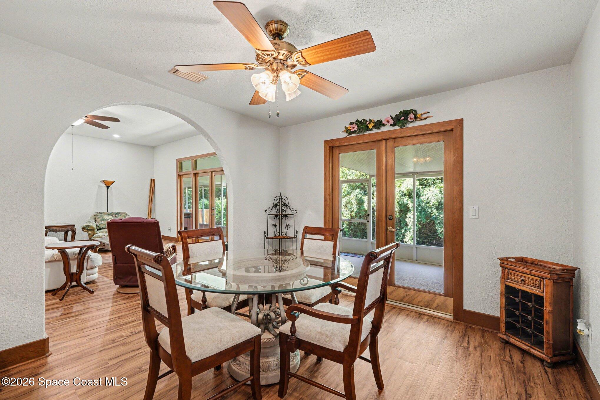2604 Senator Way Melbourne, FL 32901 - Photo 9 of 27 a dining room with furniture window and wooden floor