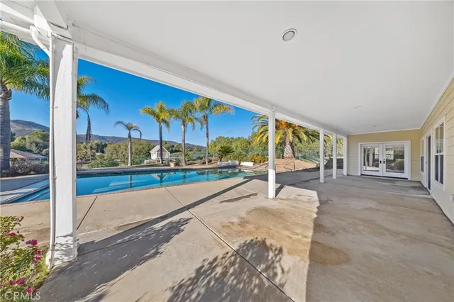 a bathroom with a sink double vanity granite and a mirror
