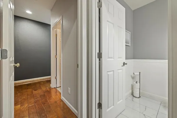 a bathroom with a tub sink and mirror