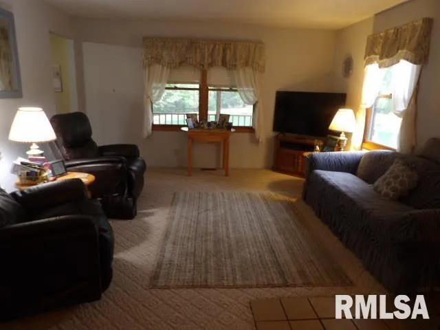 a view of a car garage and a car parked in garage