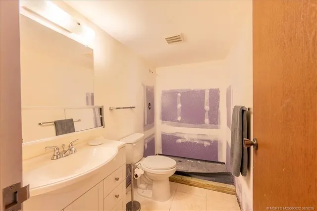 a view of a bathroom from a hallway