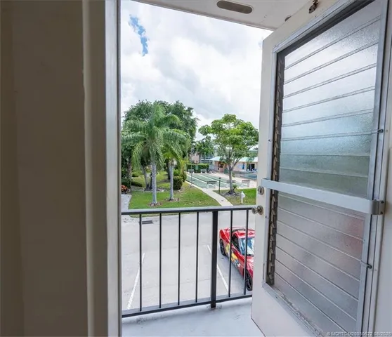 a white house with glass door and glass door