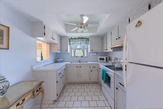 a view of workspace with natural light and wooden floor