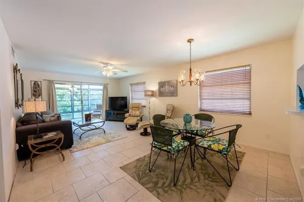 a kitchen with a sink cabinets stainless steel appliances and a window
