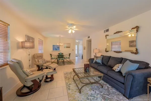 a living room filled with furniture and a large window