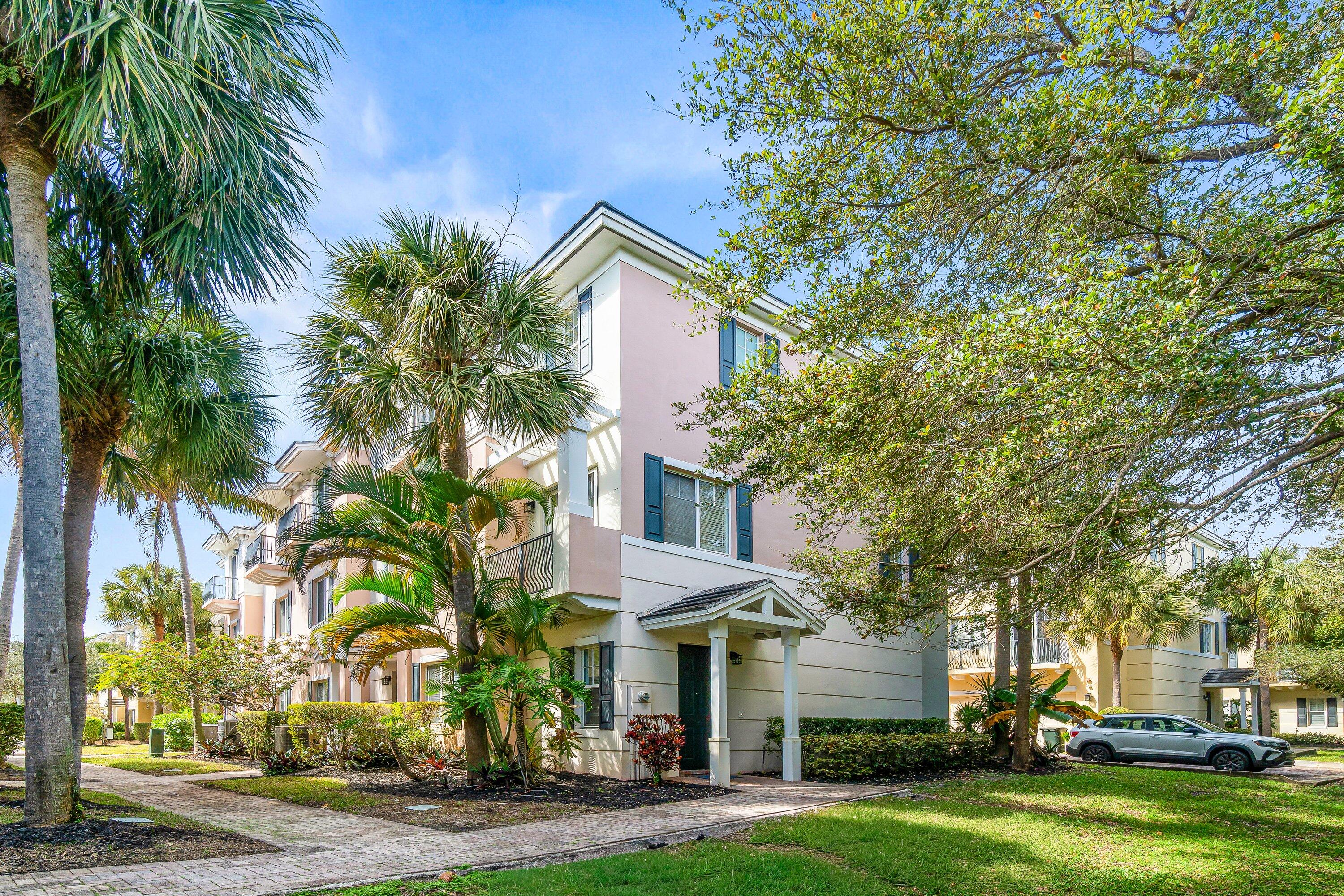 3830 Northwest 5th Terrace Boca Raton, FL 33431 - Photo 1 of 30 a front view of a house with a garden