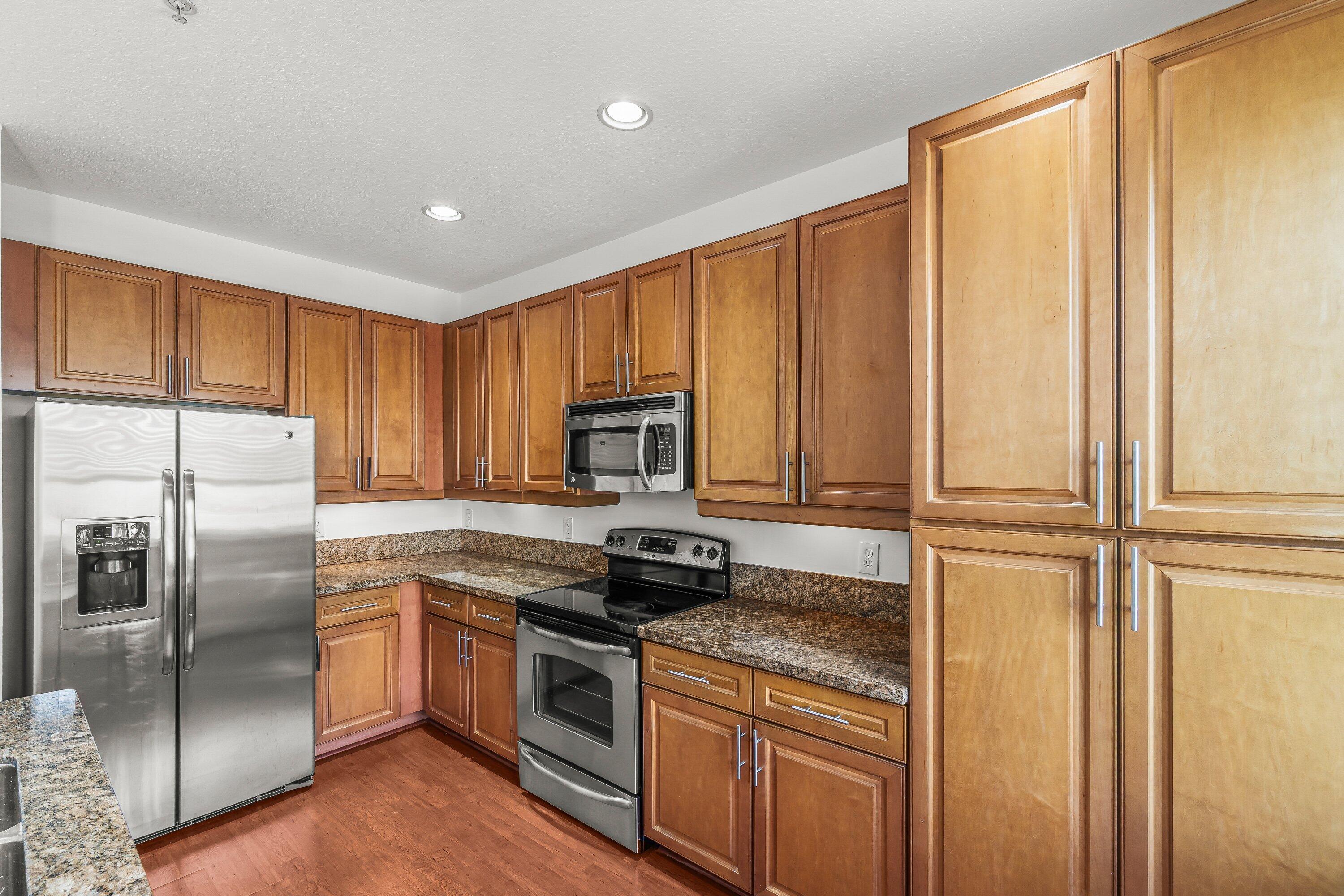 3830 Northwest 5th Terrace Boca Raton, FL 33431 - Photo 11 of 30 a kitchen with a refrigerator sink and microwave