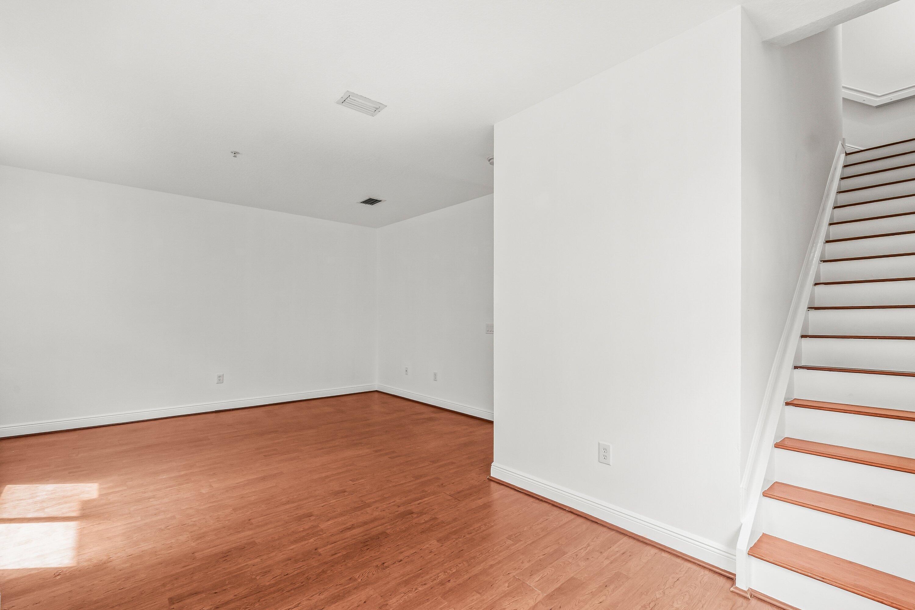 3830 Northwest 5th Terrace Boca Raton, FL 33431 - Photo 15 of 30 a view of an empty room with wooden floor