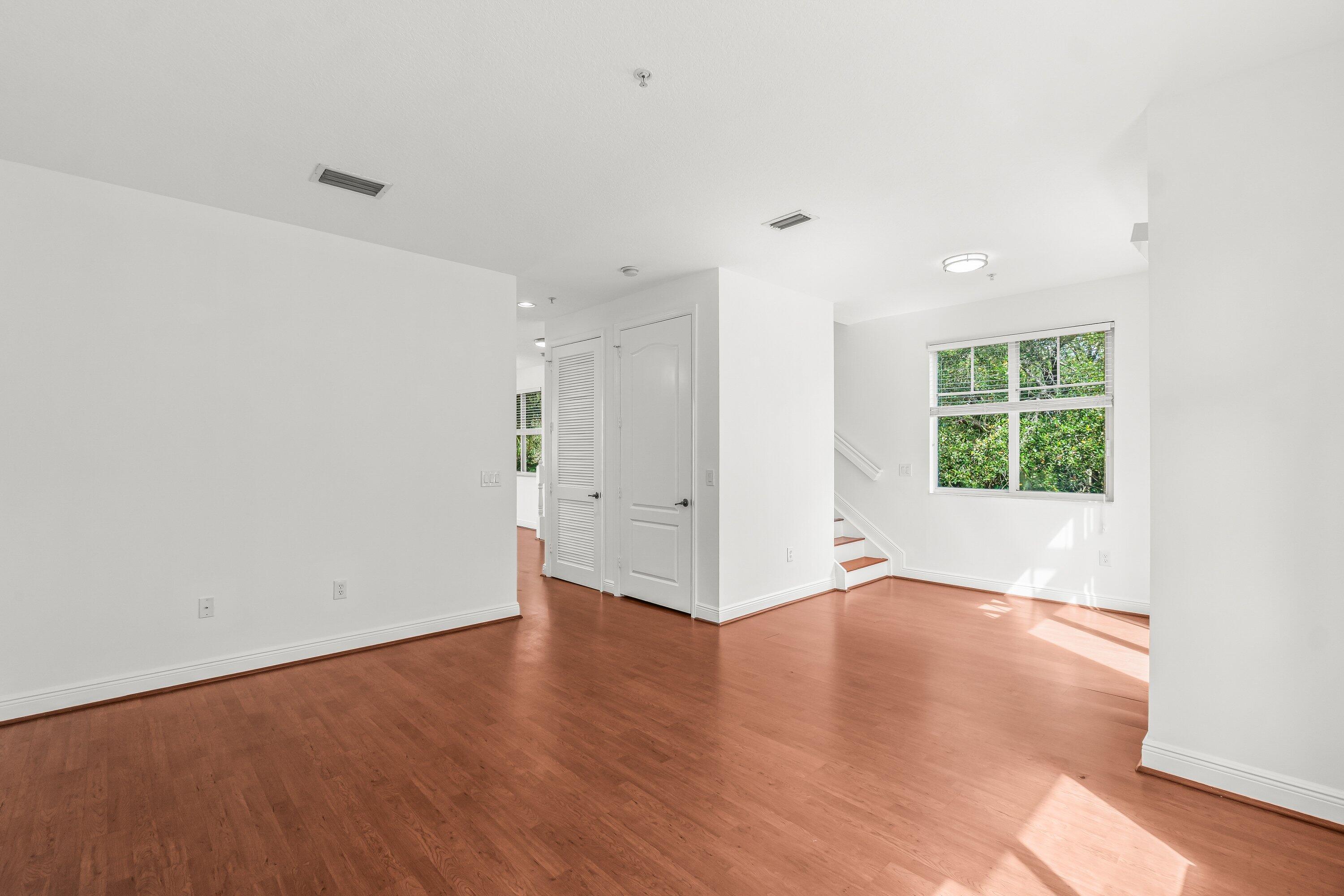 3830 Northwest 5th Terrace Boca Raton, FL 33431 - Photo 16 of 30 an empty room with wooden floor and window