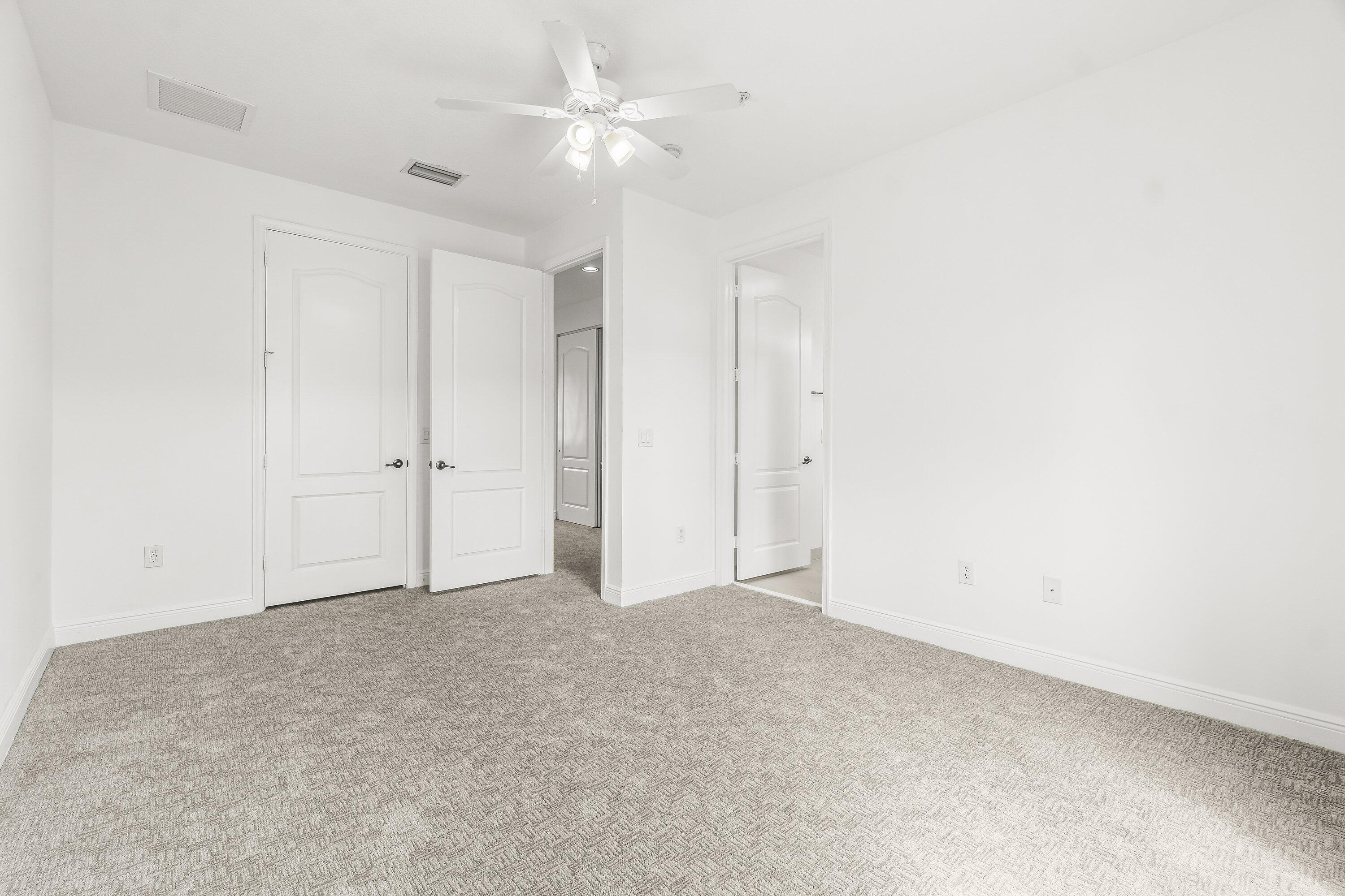 3830 Northwest 5th Terrace Boca Raton, FL 33431 - Photo 24 of 30 an empty room with a ceiling fan