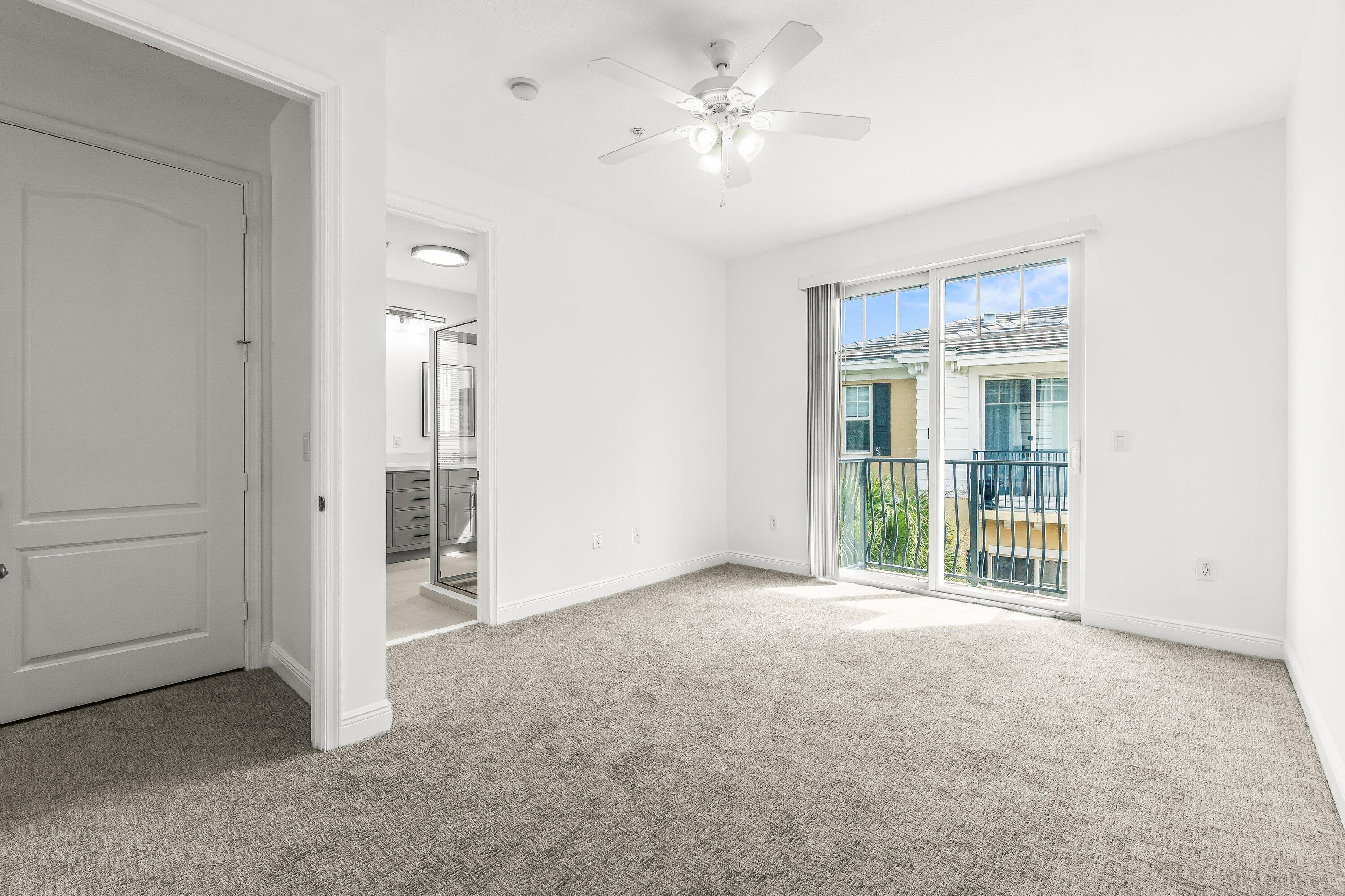3830 Northwest 5th Terrace Boca Raton, FL 33431 - Photo 25 of 30 an empty room with a ceiling fan and a window