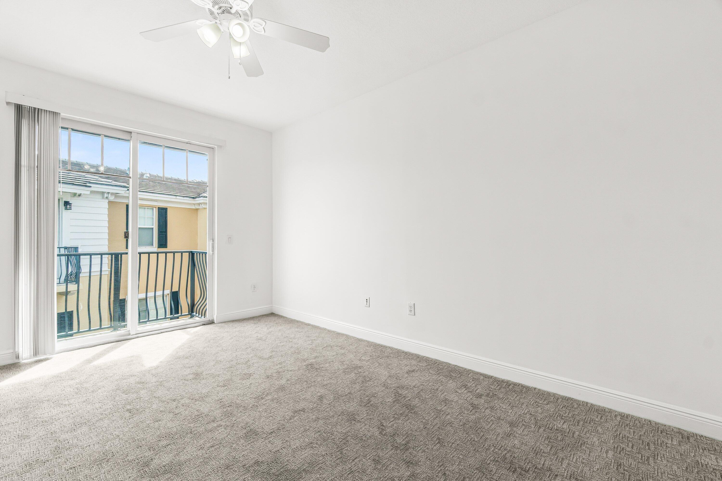 3830 Northwest 5th Terrace Boca Raton, FL 33431 - Photo 26 of 30 an empty room with a chandelier fan